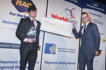 Cory Payne holding cheque for wining the Regional Safety Award 2017.