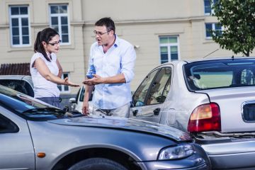 Two drivers arguing after traffic accident