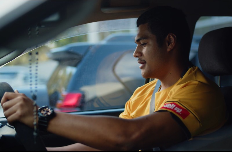 Young man in car with seat belt on