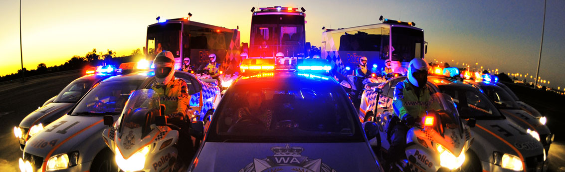 Police vehicles at dusk