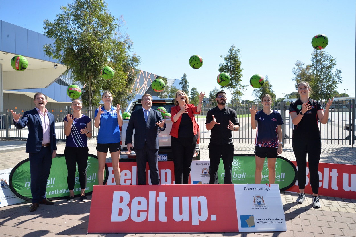 Minister for Road Safety Hon. Michelle Roberts MLA and Cory Payne, winner of the 2017 Insurance Commission Regional Safety Award, helping launch the new Belt up netball